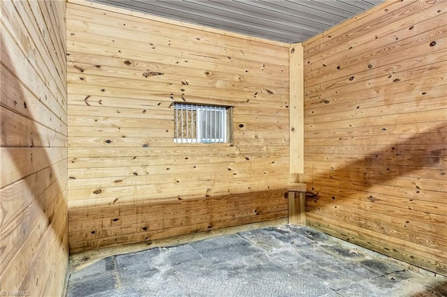interior space featuring wood walls
