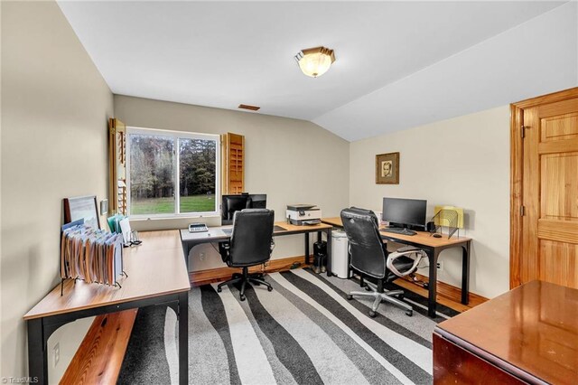 home office featuring vaulted ceiling and visible vents