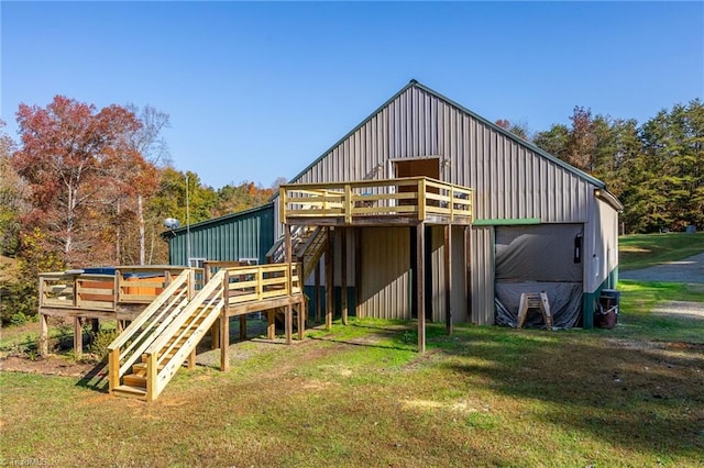 view of outbuilding featuring stairway
