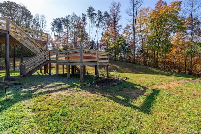 view of yard featuring stairs and a wooden deck