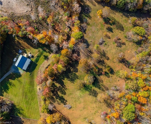 birds eye view of property with a rural view