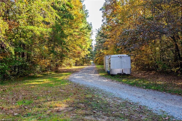 view of street with a forest view