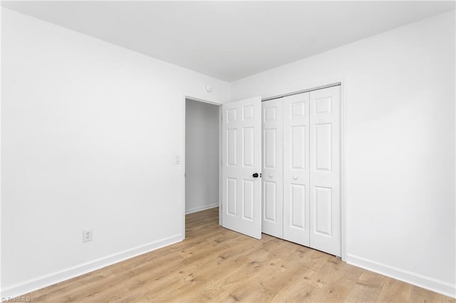 2282 Valewood Dr, Asheboro, NC 27205 - unfurnished bedroom featuring light wood-style flooring and a closet