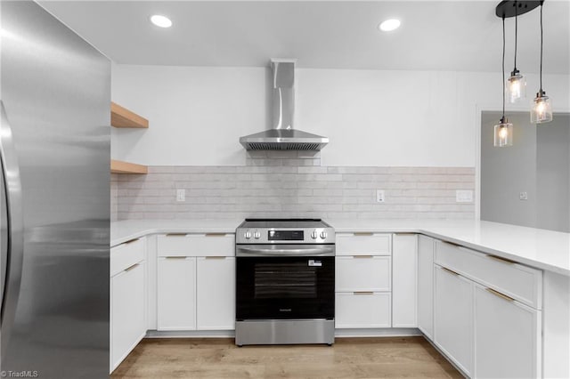 2282 Valewood Dr, Asheboro, NC 27205 - kitchen with appliances with stainless steel finishes, wall chimney range hood, white cabinetry, light countertops, and recessed lighting