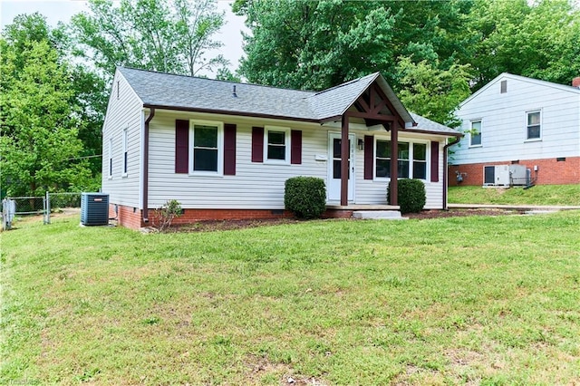 single story home with central air condition unit and a shingled roof