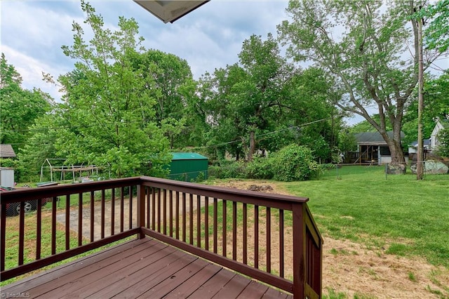 deck featuring a shed and an outbuilding
