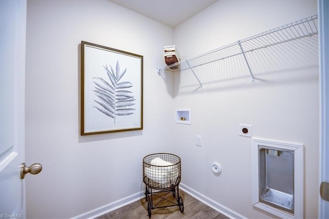 laundry room featuring gas dryer hookup, hookup for a washing machine, electric dryer hookup, and dark hardwood / wood-style flooring