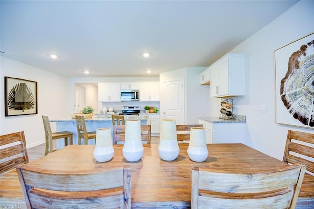 dining room with light wood-type flooring