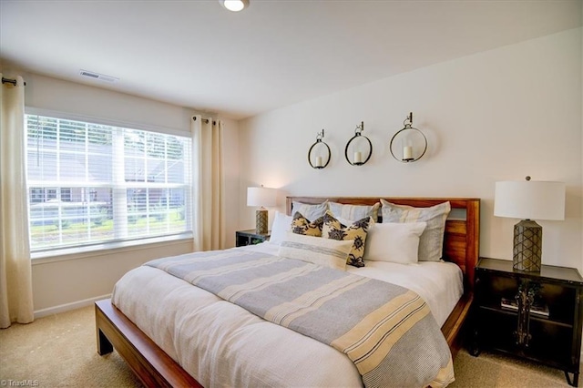 bedroom with light colored carpet