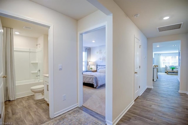 corridor featuring light hardwood / wood-style floors