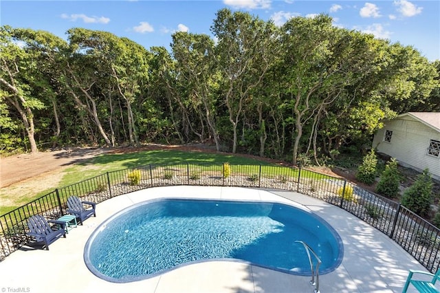 view of pool with a lawn