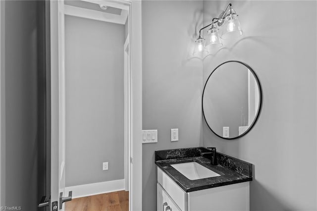 bathroom with hardwood / wood-style flooring and vanity