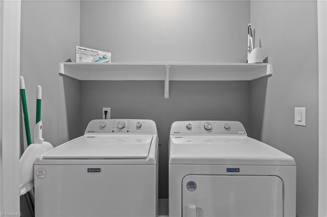 laundry area with washing machine and dryer