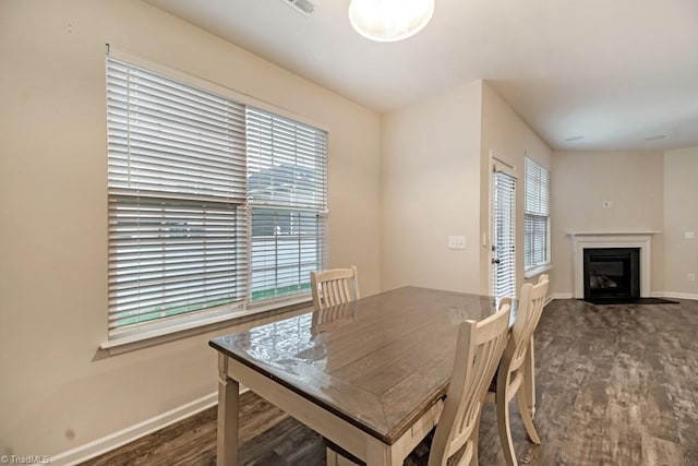 1881 Huntley Way, Burlington, NC 27215 - dining area featuring baseboards, dark wood-style flooring, and a glass covered fireplace