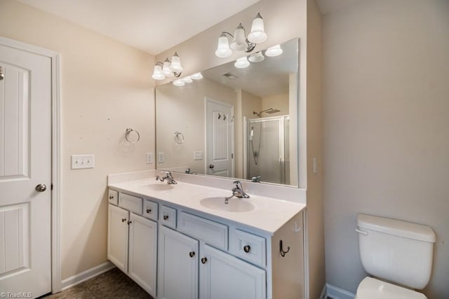 1881 Huntley Way, Burlington, NC 27215 - full bathroom featuring double vanity, a stall shower, baseboards, and toilet