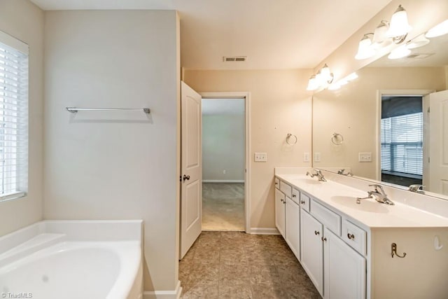 1881 Huntley Way, Burlington, NC 27215 - full bath featuring double vanity, a bath, and baseboards