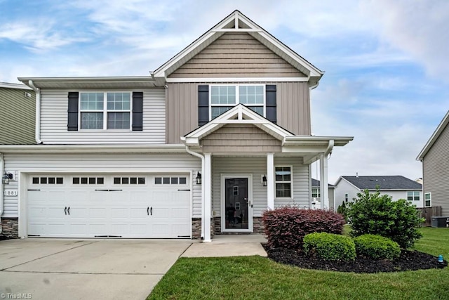1881 Huntley Way, Burlington, NC 27215 - view of front facade featuring a garage, stone siding, concrete driveway, a front yard, and central air condition unit