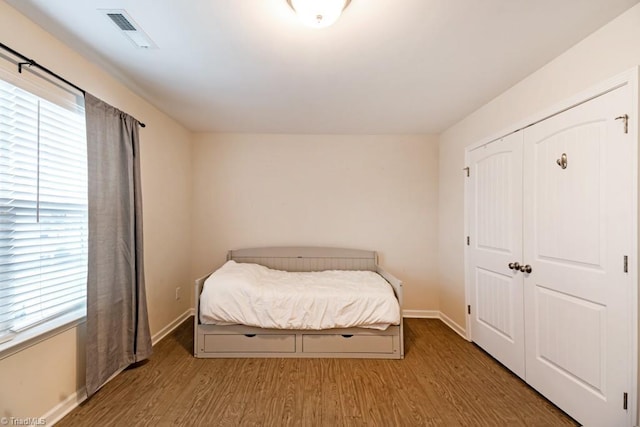 1881 Huntley Way, Burlington, NC 27215 - bedroom with wood finished floors, baseboards, and a closet