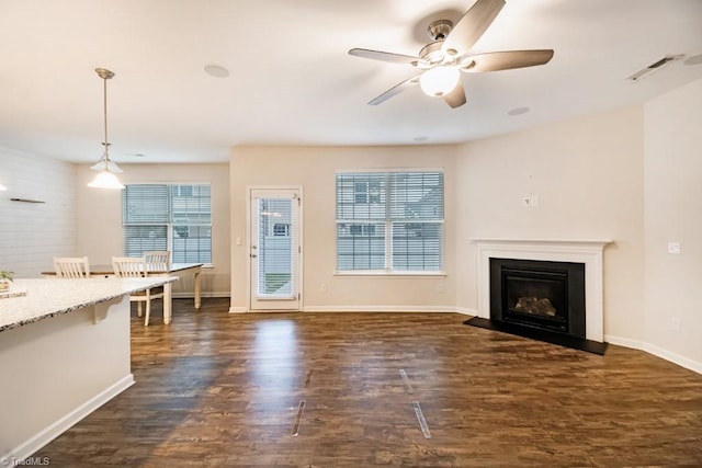 1881 Huntley Way, Burlington, NC 27215 - unfurnished living room with dark wood-type flooring, a ceiling fan, a glass covered fireplace, and baseboards