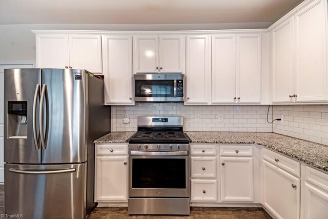 1881 Huntley Way, Burlington, NC 27215 - kitchen with appliances with stainless steel finishes, white cabinets, and light stone counters