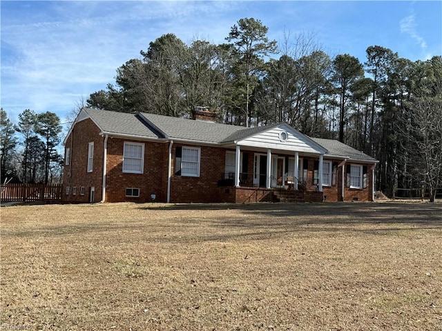 view of front of house featuring a front yard and a porch