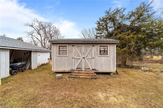 view of outdoor structure with a yard