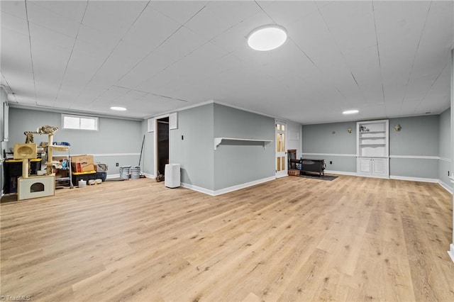 basement featuring light hardwood / wood-style flooring