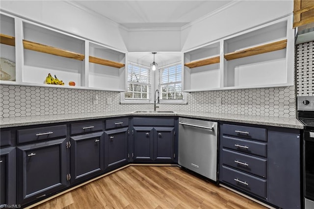 kitchen with sink, appliances with stainless steel finishes, hanging light fixtures, ornamental molding, and decorative backsplash