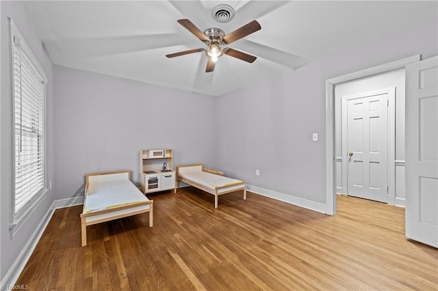 sitting room featuring hardwood / wood-style flooring and ceiling fan