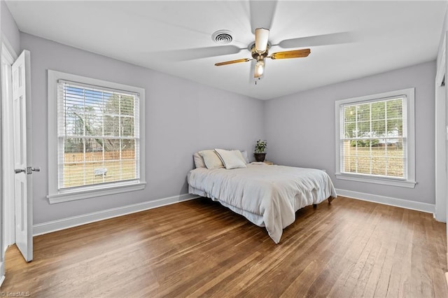 bedroom featuring hardwood / wood-style flooring and ceiling fan