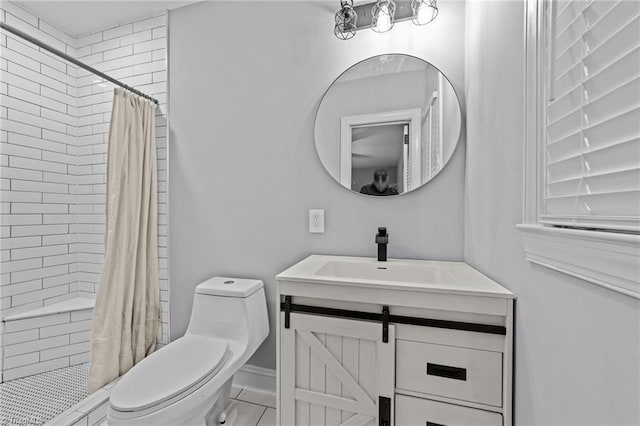 bathroom with vanity, toilet, and curtained shower