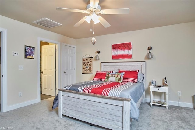 bedroom featuring ceiling fan, carpet, visible vents, and baseboards