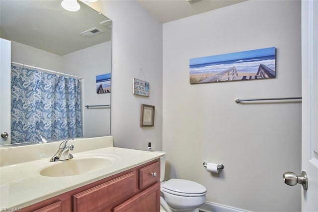 bathroom with visible vents, toilet, vanity, and a shower with curtain