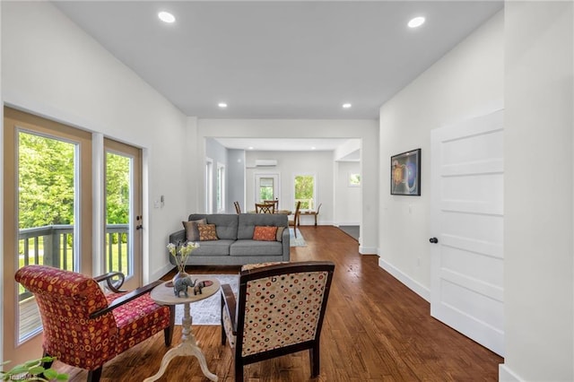 225 Main St E, Pilot Mountain, NC 27041 - living area with dark wood-style floors, recessed lighting, baseboards, and a wall mounted air conditioner