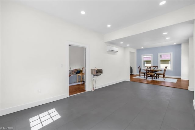 225 Main St E, Pilot Mountain, NC 27041 - unfurnished room featuring a wall mounted AC, recessed lighting, and baseboards
