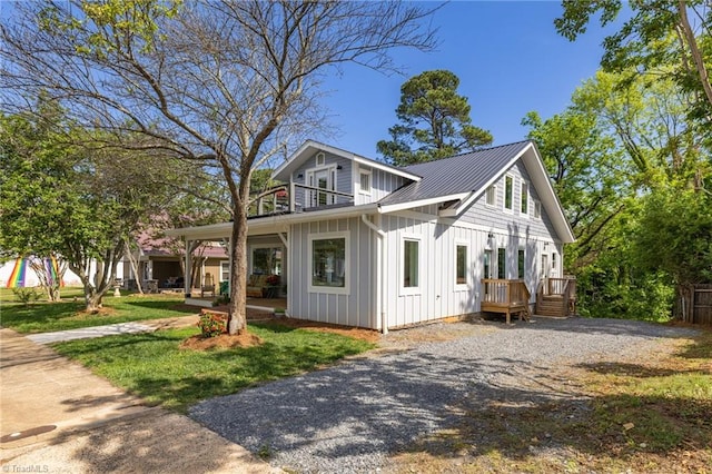 225 Main St E, Pilot Mountain, NC 27041 - view of front of property featuring board and batten siding, metal roof, and a deck