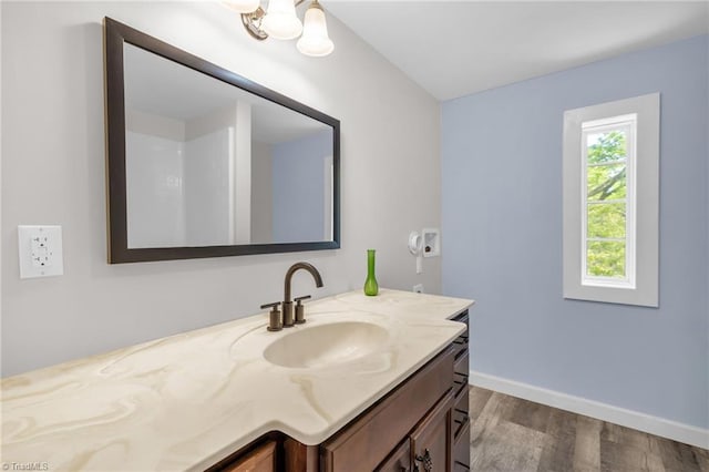 225 Main St E, Pilot Mountain, NC 27041 - bathroom with vanity, wood finished floors, and baseboards