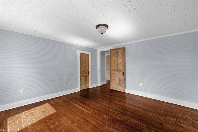 225 Main St E, Pilot Mountain, NC 27041 - unfurnished room with baseboards and dark wood-style flooring