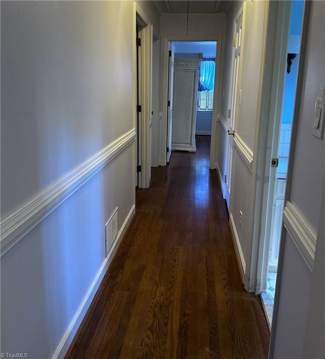 hallway featuring dark hardwood / wood-style floors