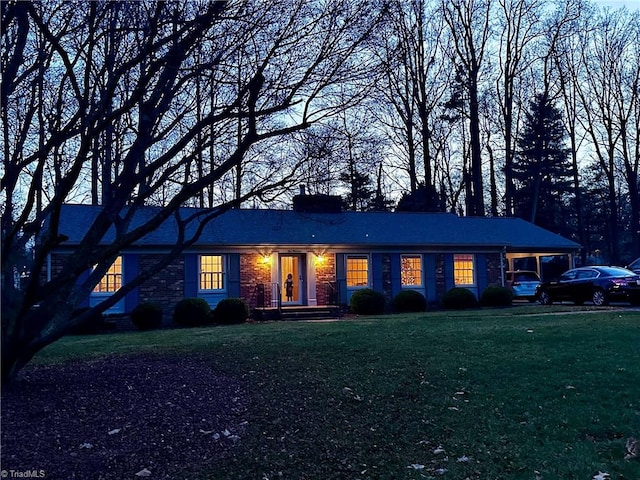 ranch-style house with a front lawn