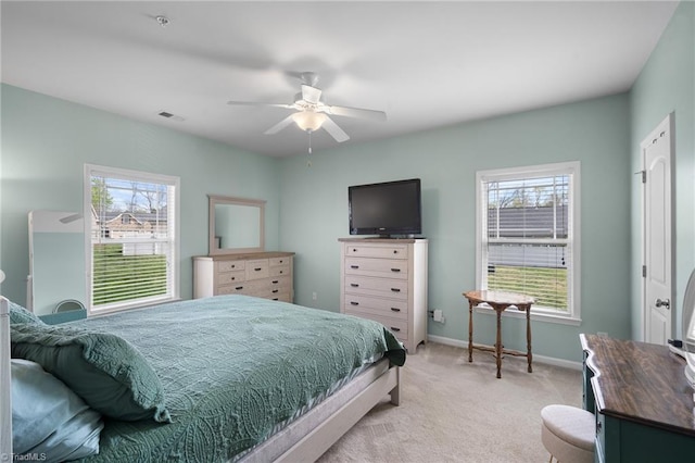 5430 Forester Dr, High Point, NC 27265 - bedroom featuring multiple windows, light colored carpet, and ceiling fan