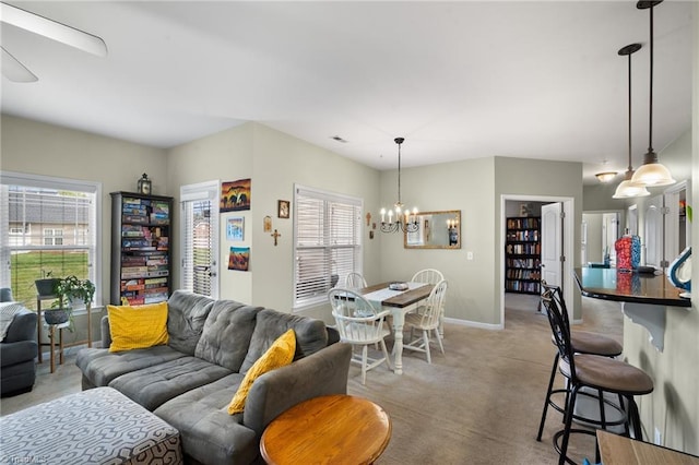 5430 Forester Dr, High Point, NC 27265 - living room featuring healthy amount of natural light, light carpet, a chandelier, and wine cooler