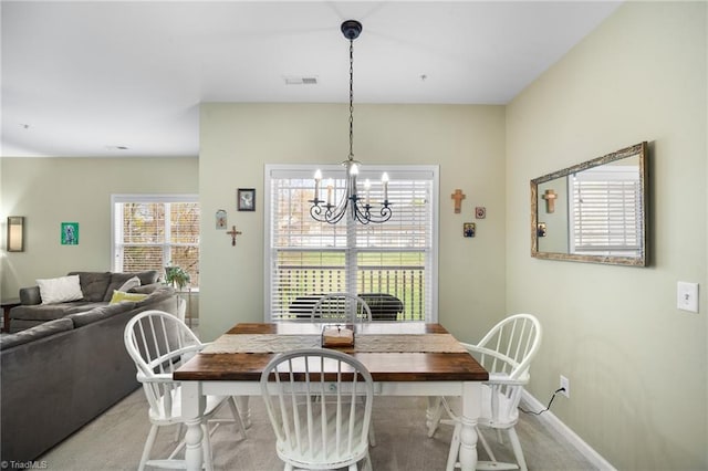 5430 Forester Dr, High Point, NC 27265 - dining room featuring a chandelier and light colored carpet
