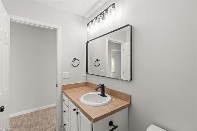 305 Apple Ridge Rd, Greensboro, NC 27406 - half bath with vanity and a textured ceiling