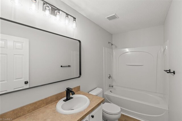 305 Apple Ridge Rd, Greensboro, NC 27406 - full bathroom with vanity, a textured ceiling, and shower / tub combination