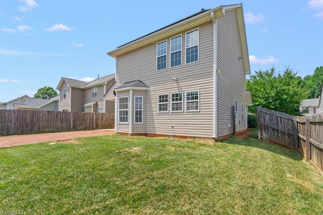305 Apple Ridge Rd, Greensboro, NC 27406 - back of house featuring a fenced backyard and a patio