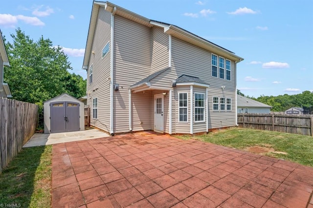 305 Apple Ridge Rd, Greensboro, NC 27406 - back of property with a patio area, a shed, and a fenced backyard