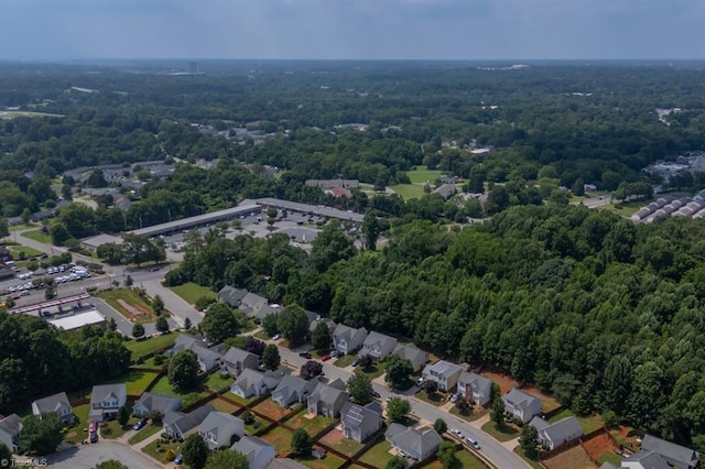 305 Apple Ridge Rd, Greensboro, NC 27406 - aerial view of property and surrounding area with a heavily wooded area and nearby suburban area