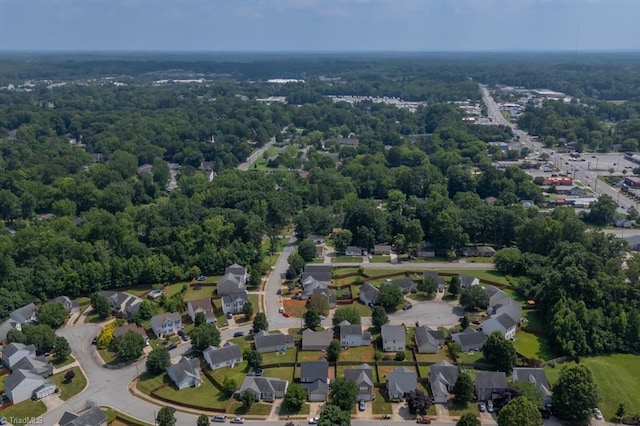 305 Apple Ridge Rd, Greensboro, NC 27406 - aerial view of property and surrounding area featuring a heavily wooded area and nearby suburban area