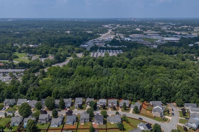305 Apple Ridge Rd, Greensboro, NC 27406 - aerial overview of property's location featuring a forest and nearby suburban area